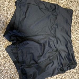 Black spandex, with pockets, size small